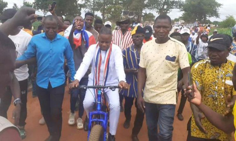 Joseph Dindiok Kpemka rides bicycle