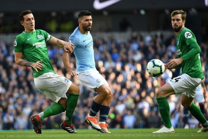 Lewis Dunk, seen here challenging Sergio Aguero, is the first Brighton player to be called up by England in more than 35 years