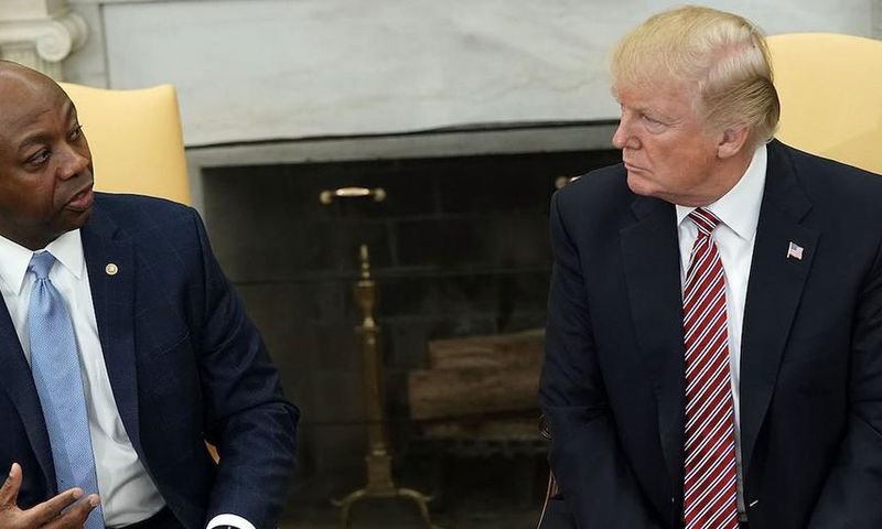 President Donald Trump with South Carolina Republican Sen. Tim Scott.