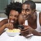 Black couple watching a movie
