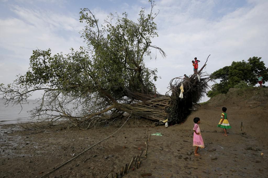 An island in India is disappearing, but some of the last residents say they can't afford to move away