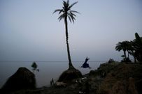 An island in India is disappearing, but some of the last residents say they can't afford to move away