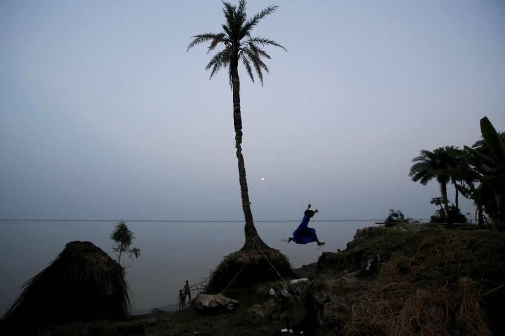 An island in India is disappearing, but some of the last residents say they can't afford to move away