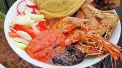 Ga kenkey served with pepper and fish