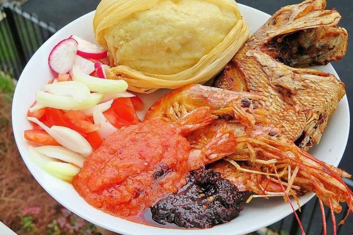 Ga kenkey served with pepper and fish