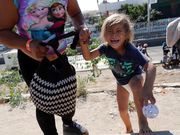 Powerful photos and stories from the caravan show migrants' harrowing journey to the US