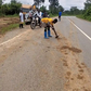 Illegal miners wash mud on road
