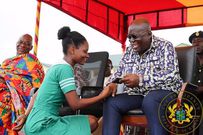 Nana Addo with a nurse