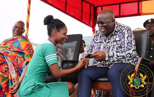 Nana Addo with a nurse