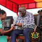 Nana Addo with a nurse