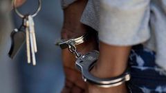 A woman in handcuffs