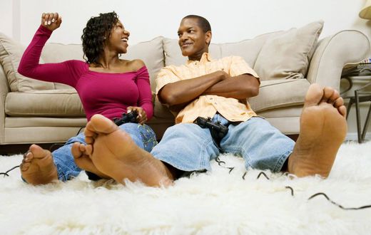 Man and woman playing video game