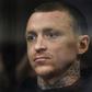 Russian footballer Pavel Mamaev, detained as a suspect in a criminal probe over hooliganism following an unprovoked attack on two government officials, attends a court hearing in Moscow on October 11, 2018