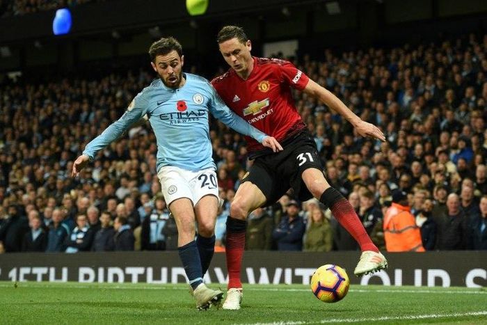 Manchester City's Bernardo Silva (L), seen here competing with Manchester United's Nemanja Matic, believes City's 3-1 derby win has done major damage to their local rivals' hopes of winning the Premier League title this season