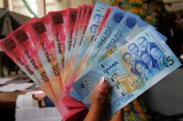 Residents in shock as a strange rich man keeps paying their debts and dropping money envelopes at their doorsteps (video)