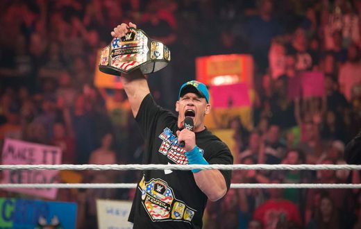 John Cena at WWE's "Raw" in 2015. Netflix viewers will be able to start streaming some WWE pro wrestling in 2025 because of a new $5 billion deal.Suzanne Cordeiro/Corbis via Getty Images