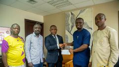 The Minister for Youth and Sports presented the cheque on behalf of the President