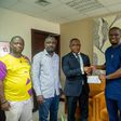 The Minister for Youth and Sports presented the cheque on behalf of the President