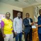 The Minister for Youth and Sports presented the cheque on behalf of the President