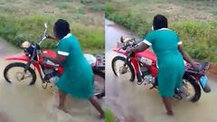 Akufo-Addo, we’re suffering – Nurses cry while pushing motorbike through stream