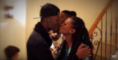 Reggie Zippy kisses wife