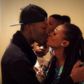 Reggie Zippy kisses wife