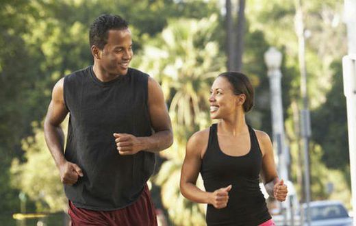 Black man and woman running