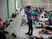 Powerful photos and stories from the caravan show migrants' harrowing journey to the US