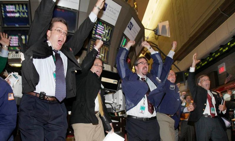 traders celebrating soccer world cup
