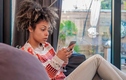 Woman surprised using iPhone