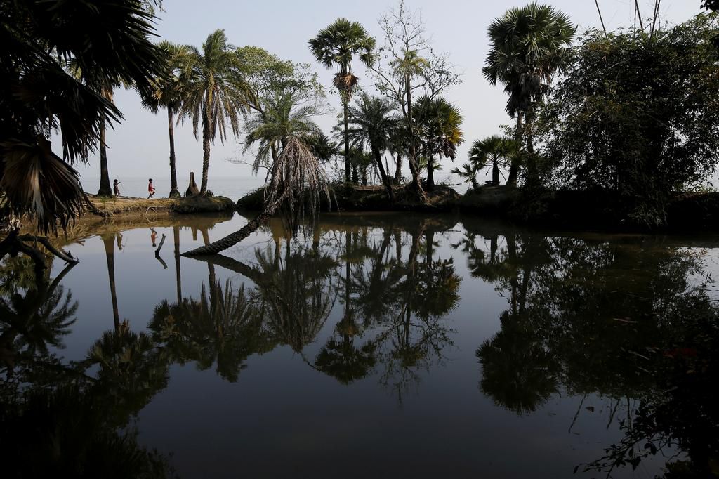An island in India is disappearing, but some of the last residents say they can't afford to move away