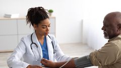 Female doctor with her patient [AmericanHeart]
