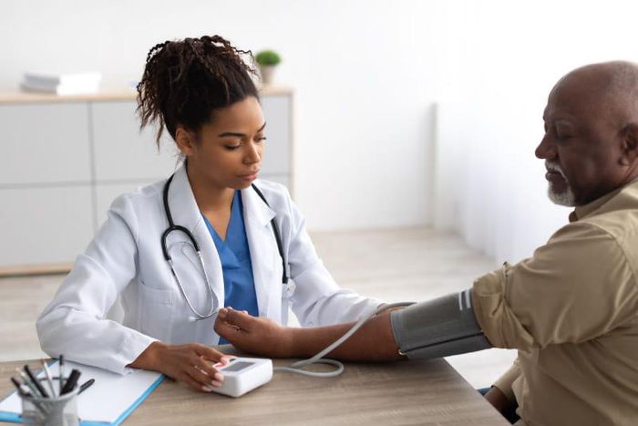 Female doctor with her patient [AmericanHeart]