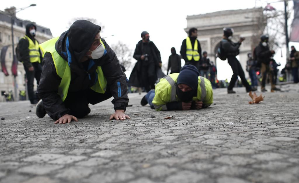 More than 1,300 were arrested and dozens injured after violent anti-government protests engulfed France — here's how the clashes unfolded