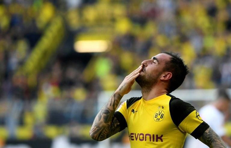 Borussia Dortmund striker Paco Alcacer celebrates sealing his hat-trick