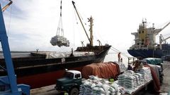 Kenyan port workers load relief food to a Somalia-bound ship at the Kenyan port of Mombasa, October 10 2011 . REUTERS/Joseph Okanga