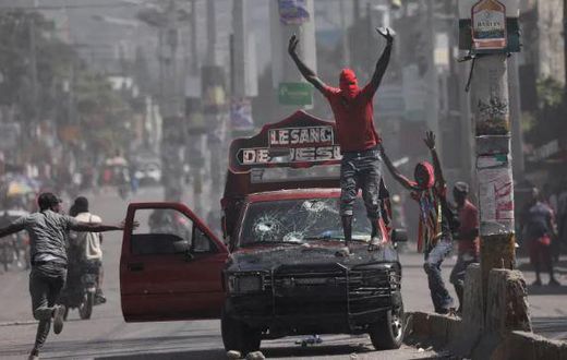 Violence rocked the streets of Haiti's Capital Port-Au-Prince with armed gangs taking on the police