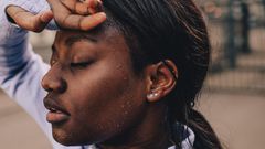 Sweating a lot while working out can be attributed to wearing too tight of clothes, eating a big meal before being active, physiological factors, or the medical issue hyperhidrosis.AleksandarNakic/Getty Images