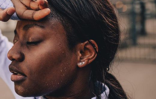 Sweating a lot while working out can be attributed to wearing too tight of clothes, eating a big meal before being active, physiological factors, or the medical issue hyperhidrosis.AleksandarNakic/Getty Images