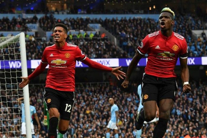 Manchester United's Chris Smalling and Paul Pogba celebrate a famous 3-2 win in April that delayed Manchester City's title celebrations