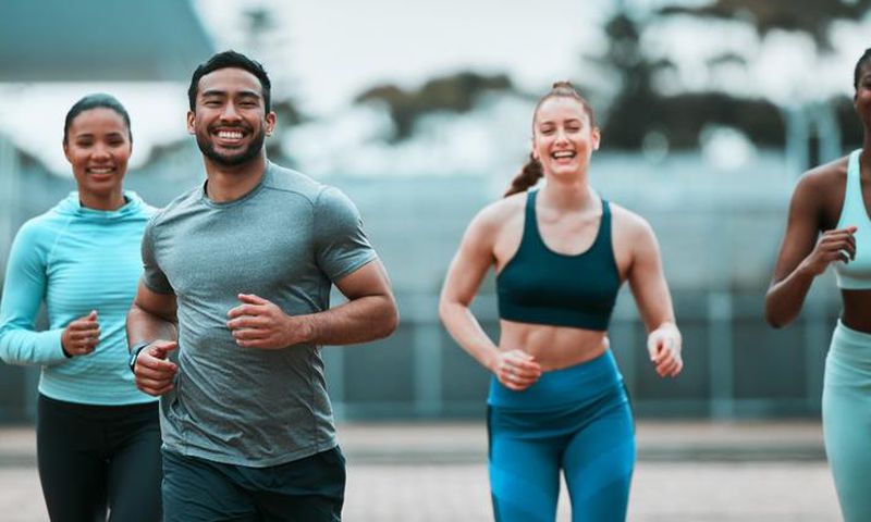 Stock photo: A group-of-young-people-running-together