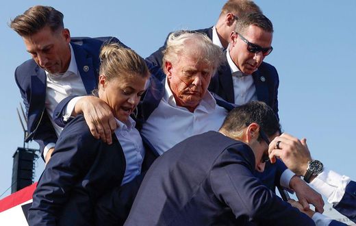 Donald Trump gets helped off the stage by aides in Pennsylvania on July 13 after an assassination attempt.Anna Moneymaker/Getty Images