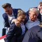 Donald Trump gets helped off the stage by aides in Pennsylvania on July 13 after an assassination attempt.Anna Moneymaker/Getty Images
