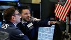 Traders work on the floor of the New York Stock Exchange ahead of the opening bell in New York, U.S., February 7, 2018. REUTERS/Brendan Mcdermid