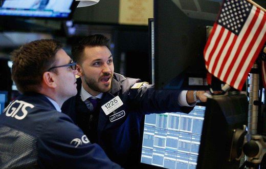 Traders work on the floor of the New York Stock Exchange ahead of the opening bell in New York, U.S., February 7, 2018. REUTERS/Brendan Mcdermid