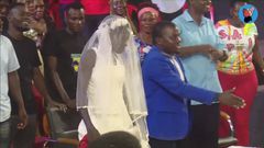 The woman was called to the pulpit to be prayed for