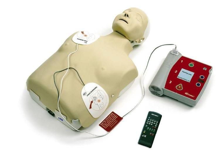 A dummy showing how to use an AED