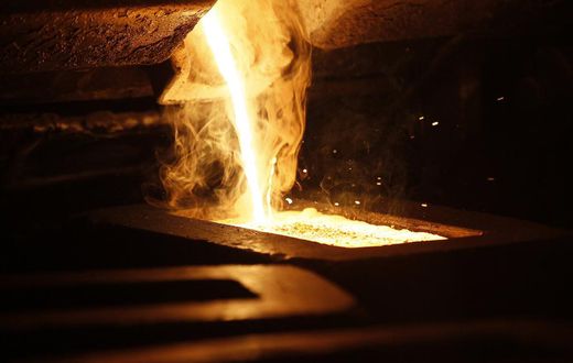 Liquid gold is poured to form gold dore bars at Newmont Mining's Carlin gold mine operation near Elko.