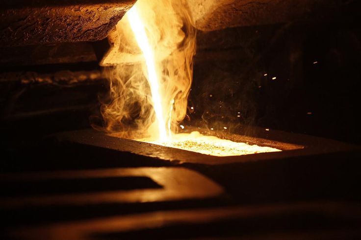 Liquid gold is poured to form gold dore bars at Newmont Mining's Carlin gold mine operation near Elko.