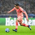 Barcelona's midfielder Philippe Coutinho runs with the ball under pouring rain during the UEFA Champions League group B football match against Inter Milan November 6, 2018 at San Siro stadium in Milan